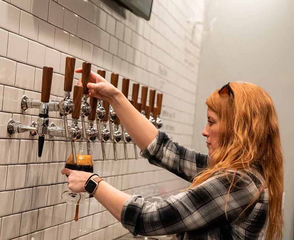 Sara Pouring Beer At Garth's Brew Bar